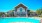 a swimming pool in front of a house