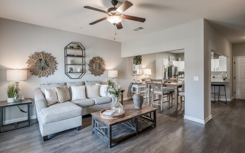 a living room with a ceiling fan