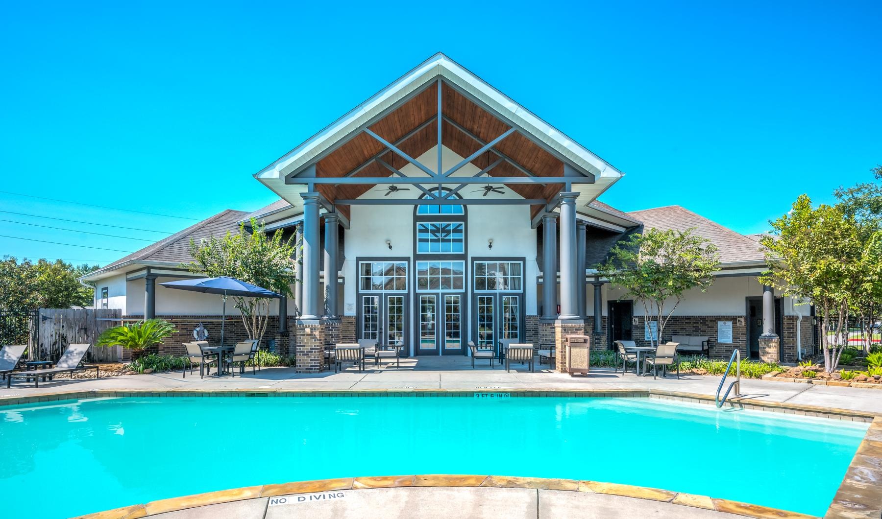 a swimming pool in front of a house